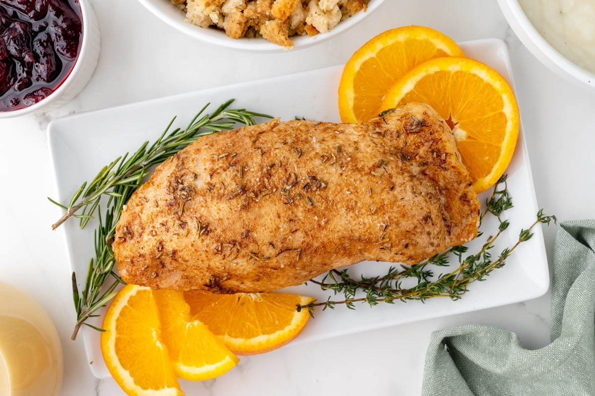 overhead shot of whole slow cooker turkey breast on platter