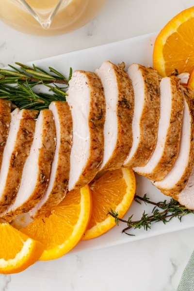 overhead shot of sliced slow cooker turkey breast on a platter