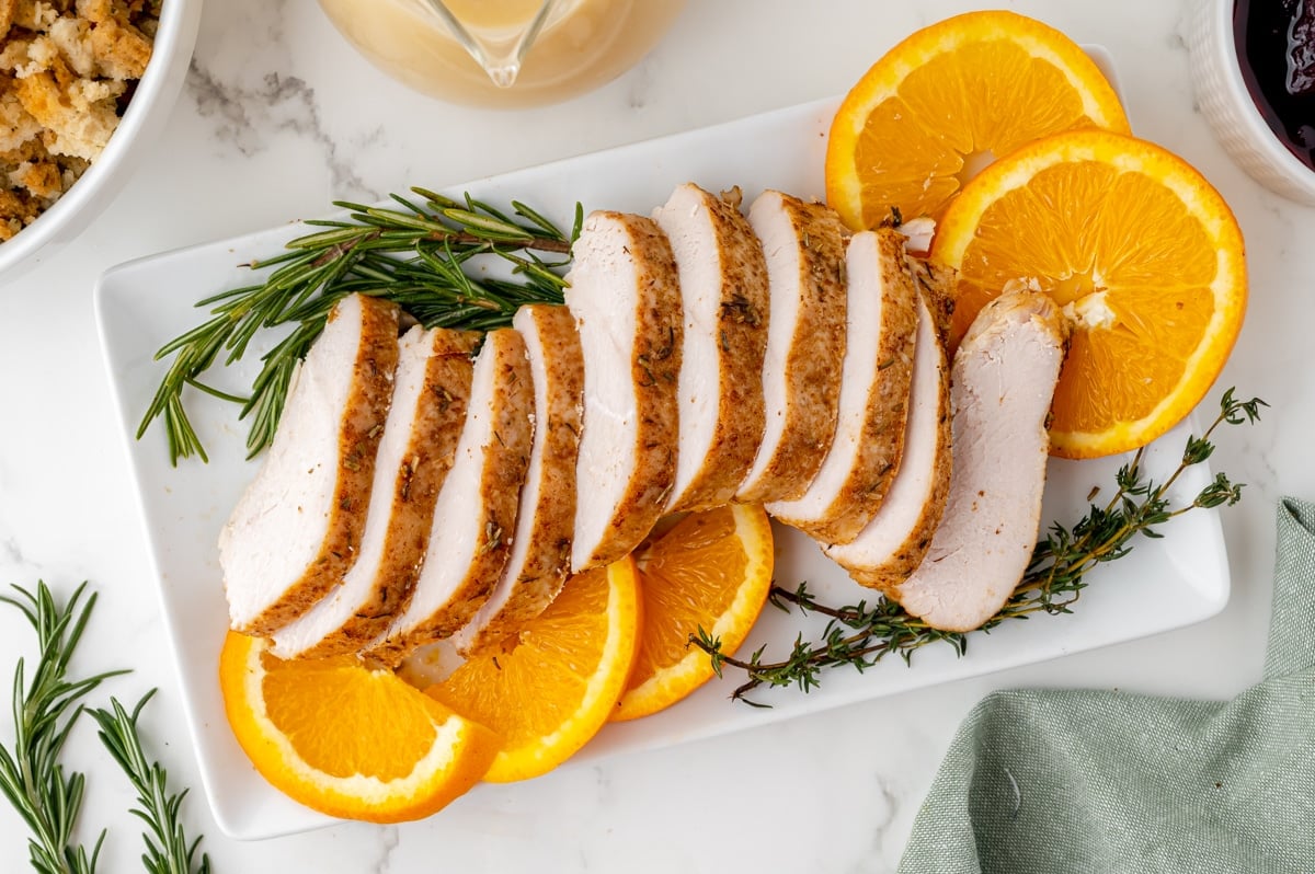 overhead shot of sliced slow cooker turkey breast on a platter