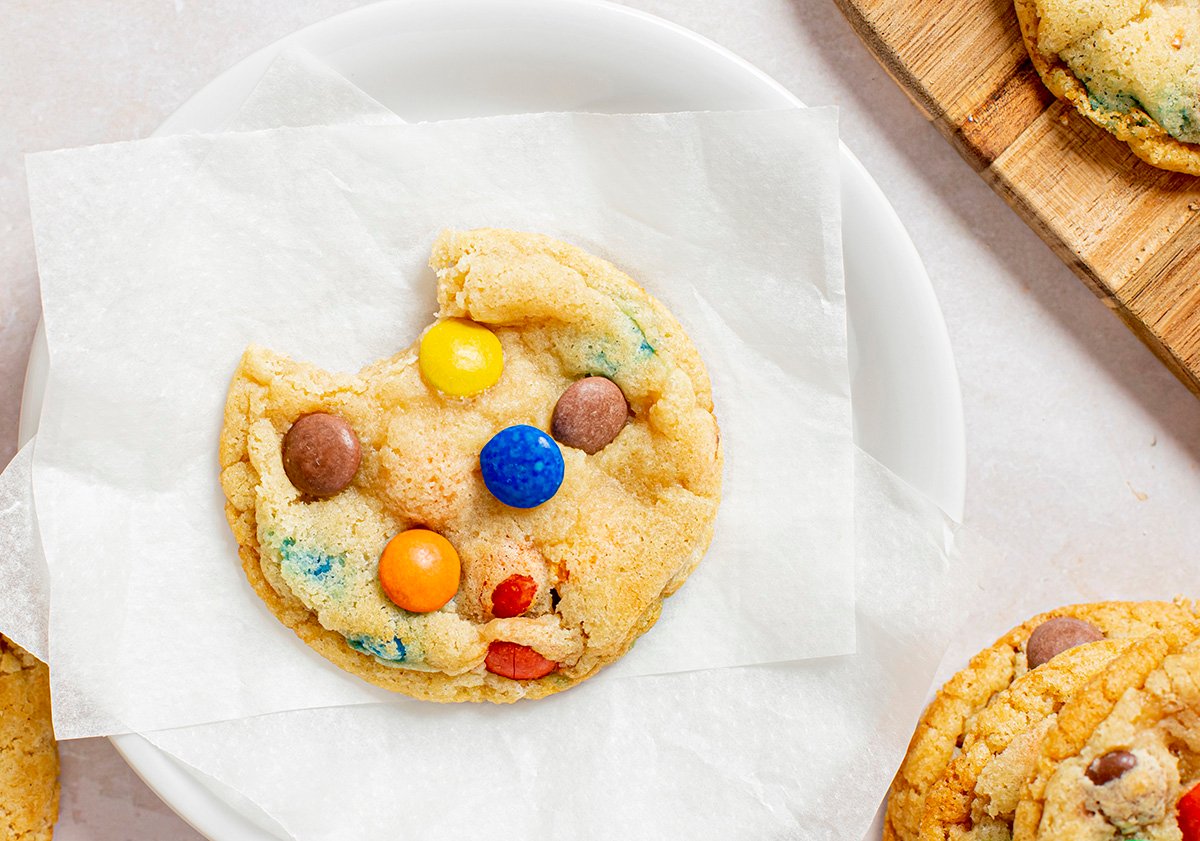 close up of bite taken out of cookie on plate