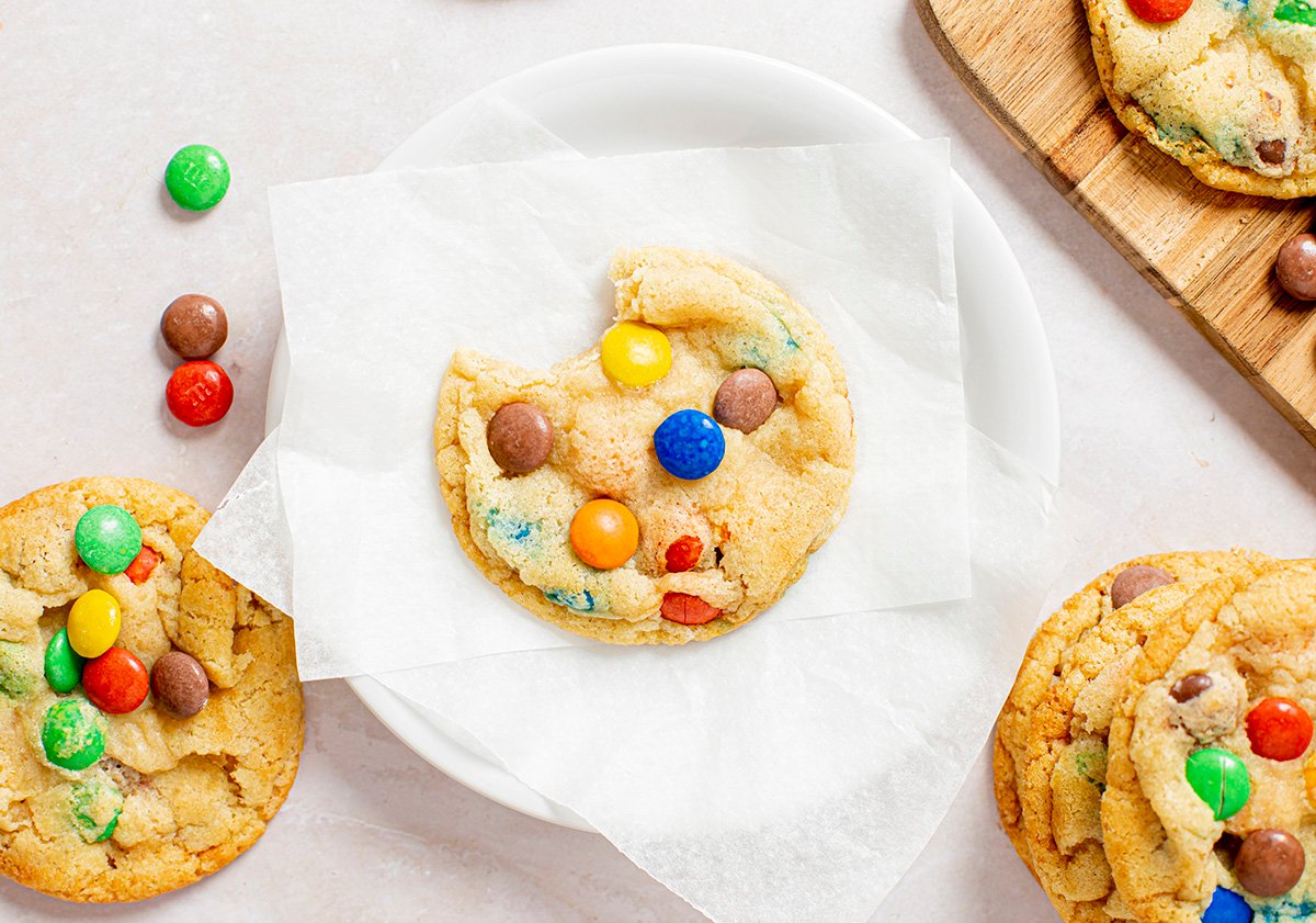 overhead shot of bite taken out of cookie on a plate