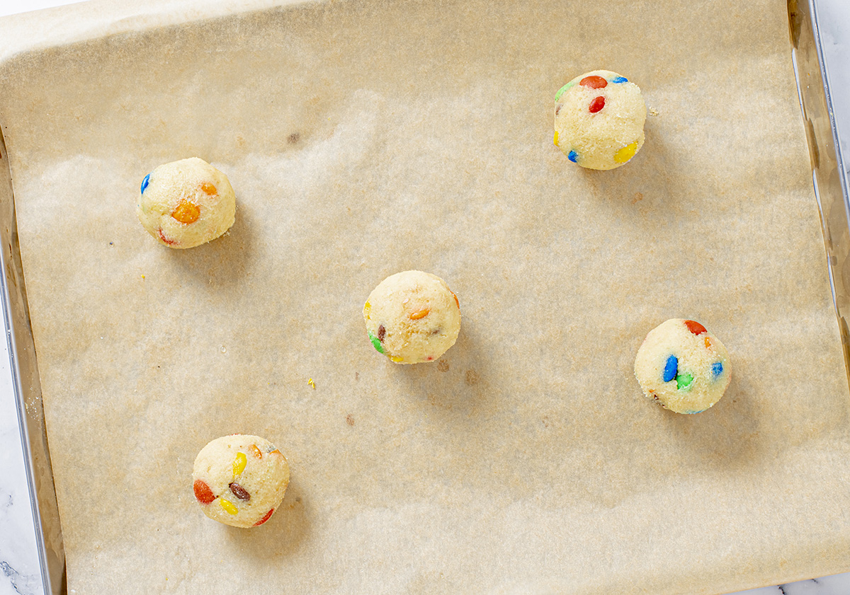 cookie dough balls on sheet pan