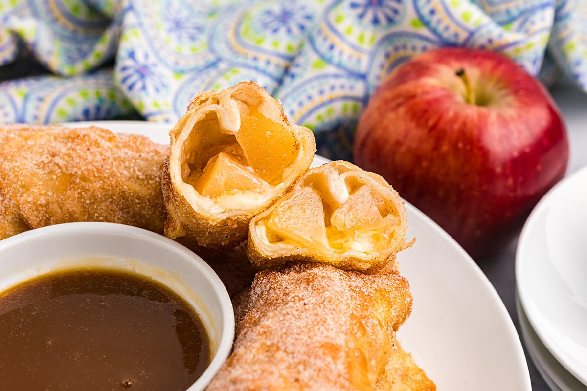 angled shot of apple egg roll cut in half