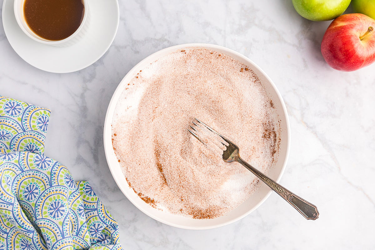 bowl of cinnamon sugar with fork in it