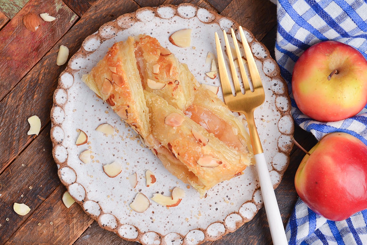 close up overhead shot of slice of apple strudel on plate