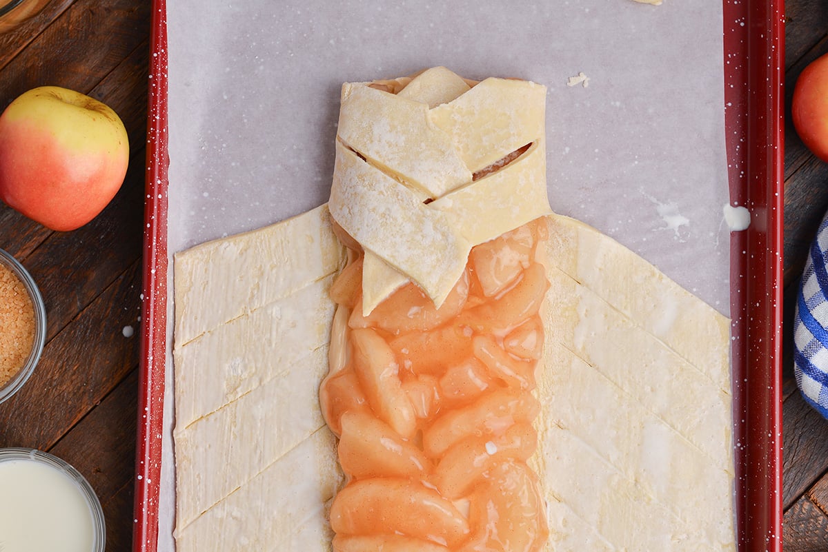 overhead shot of pastry folded over apple filling
