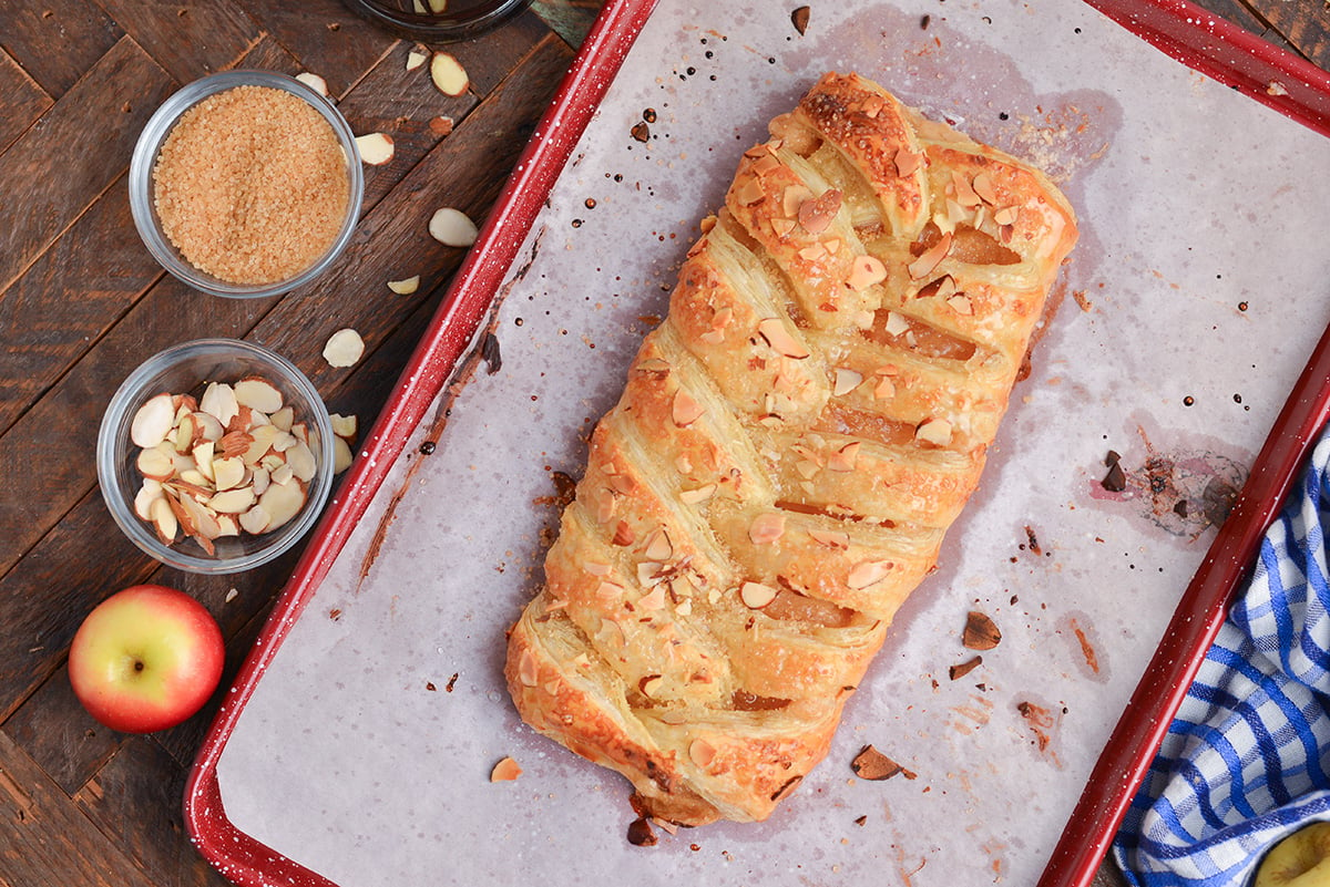 overhead shot of baked apple strudel on baking sheet