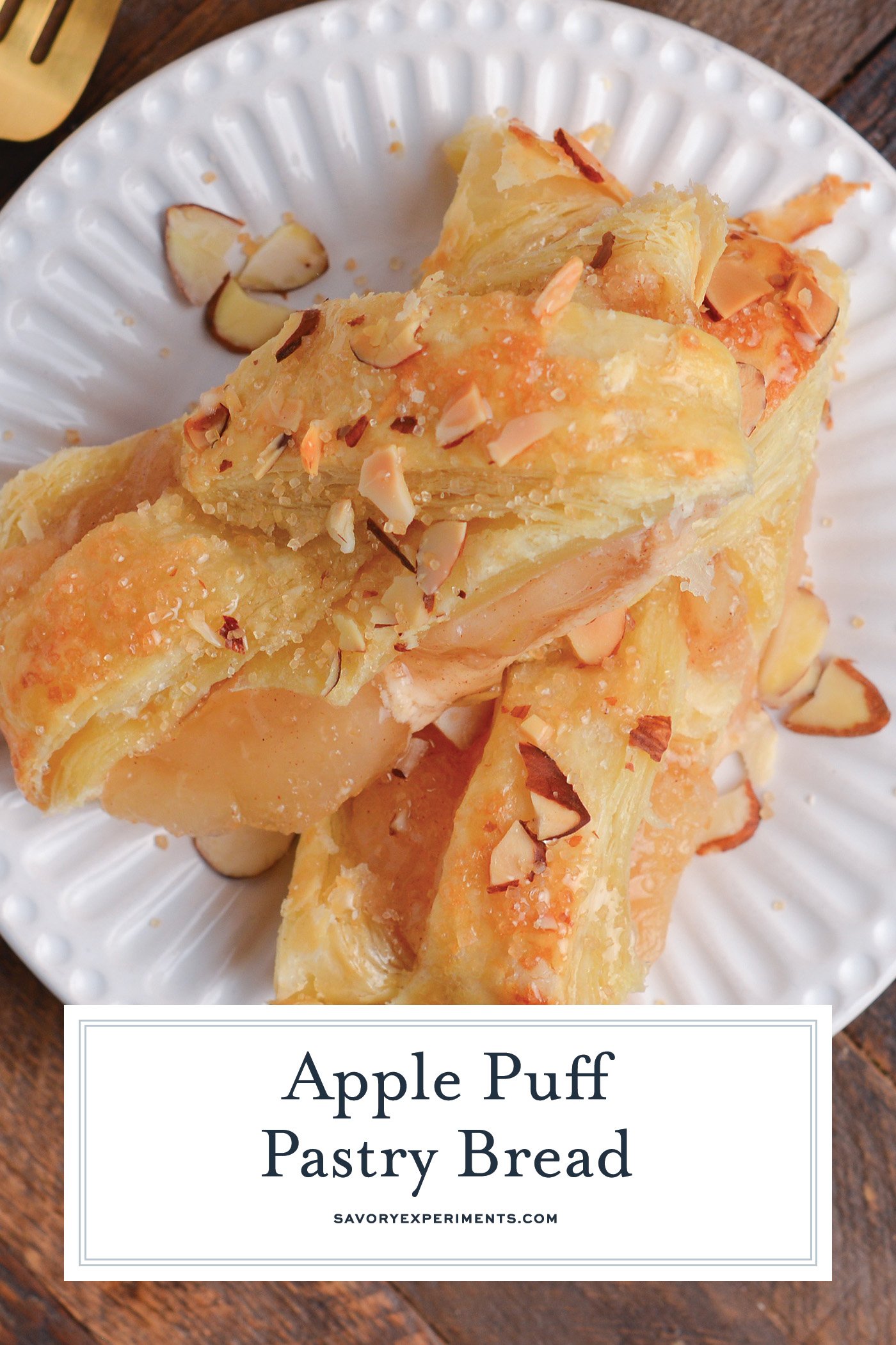 overhead shot of two slices of apple strudel on plate with text overlay for pinterest