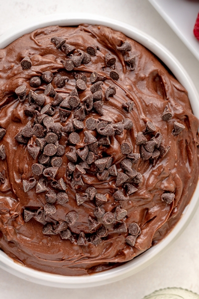 overhead bowl of brownie batter dip topped with mini chocolate chips