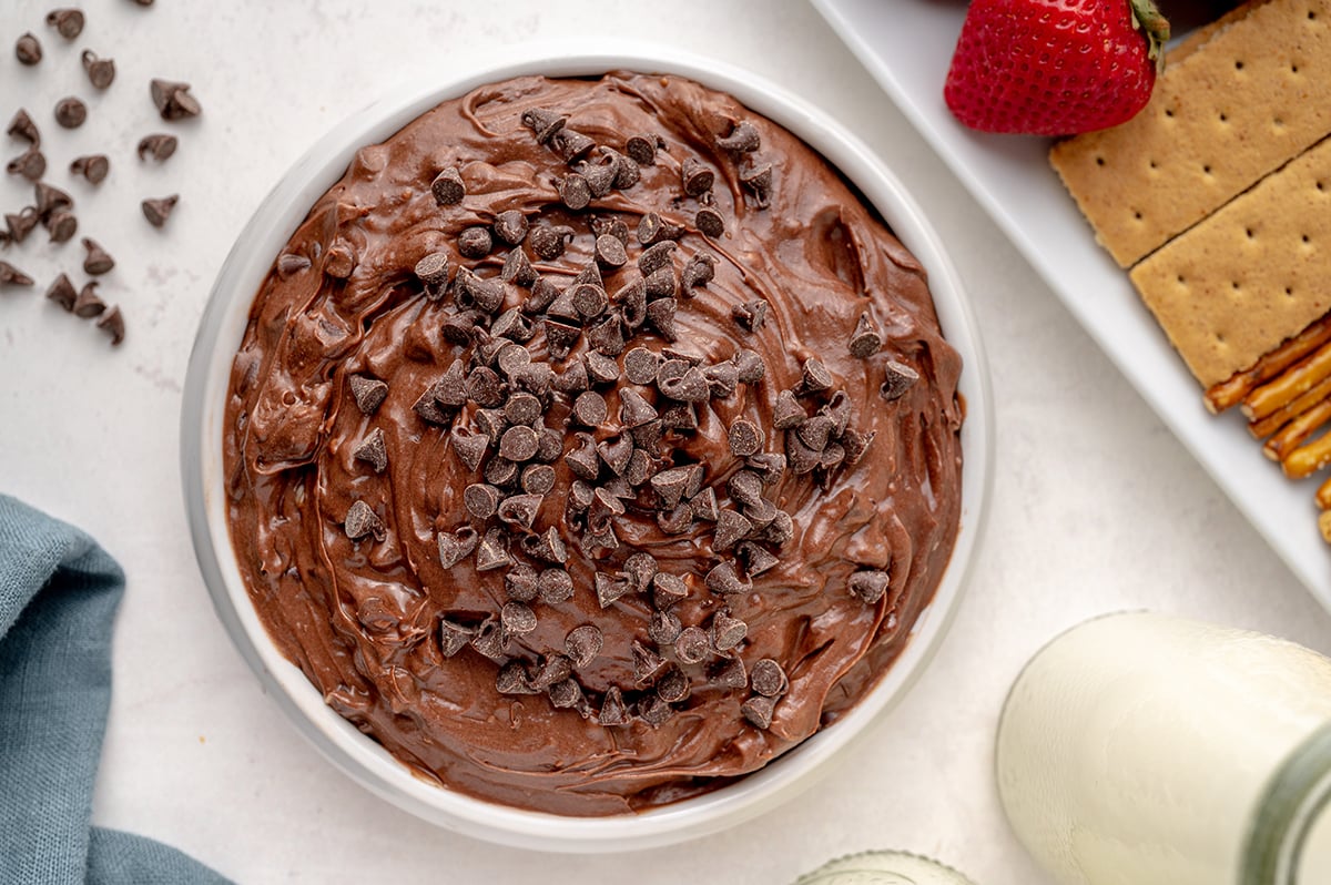 overhead bowl of brownie batter dip topped with mini chocolate chips