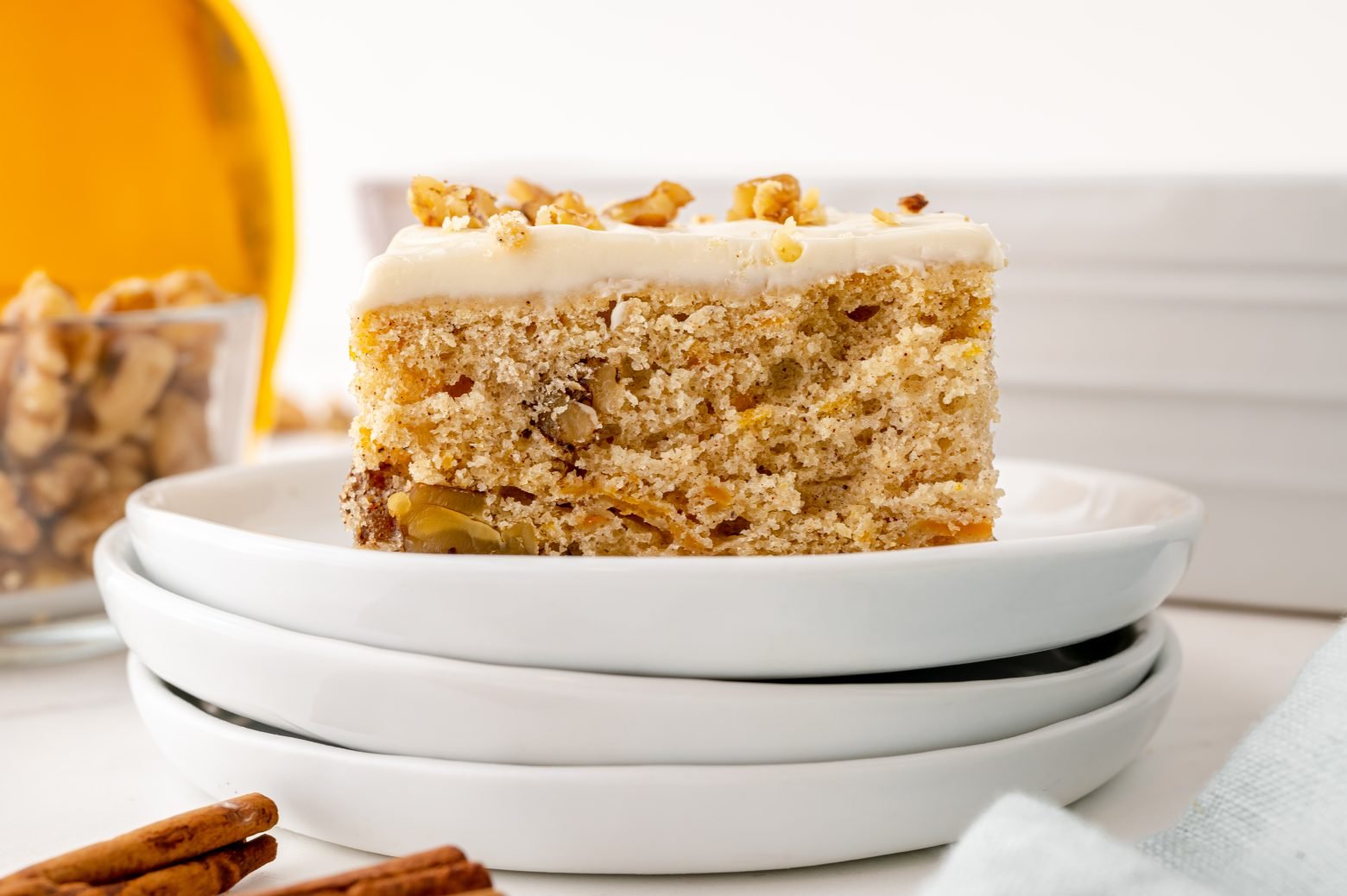 slice of butternut squash cake with maple frosting