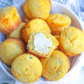 angled shot of bowl of jalapeno cheddar cornbread muffins