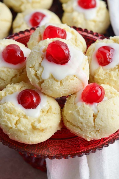 cherry cheesecake cookies piled on a red serving platter