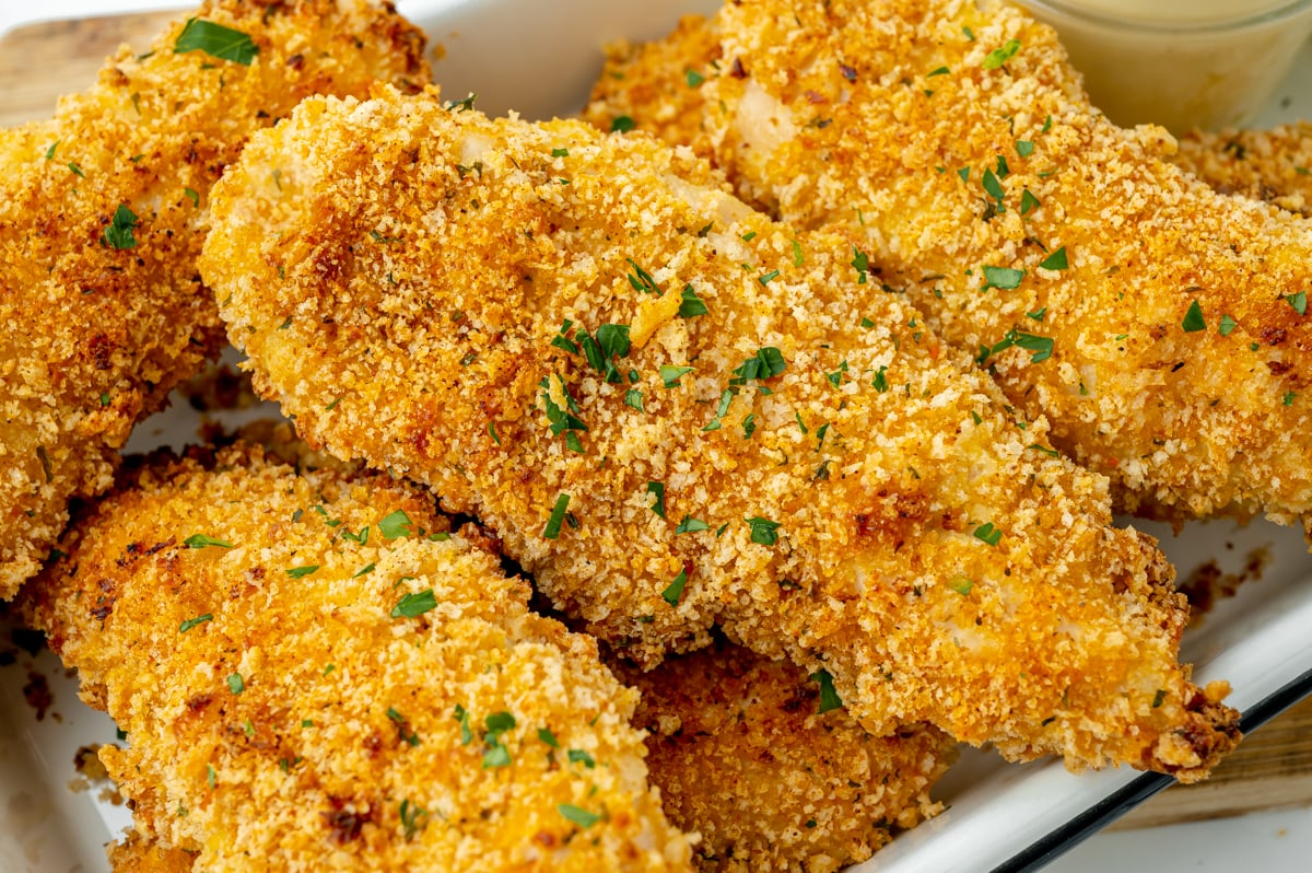close up angled shot of crispy baked chicken tenders