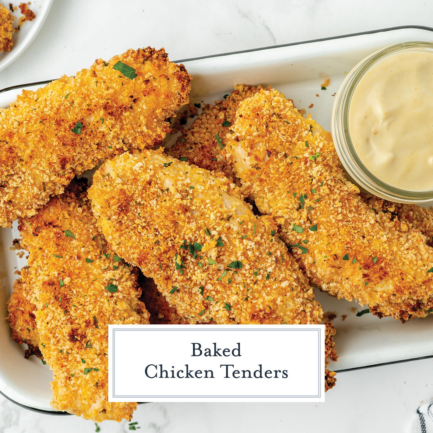 overhead shot of tray of crispy baked chicken tenders with text overlay for facebook