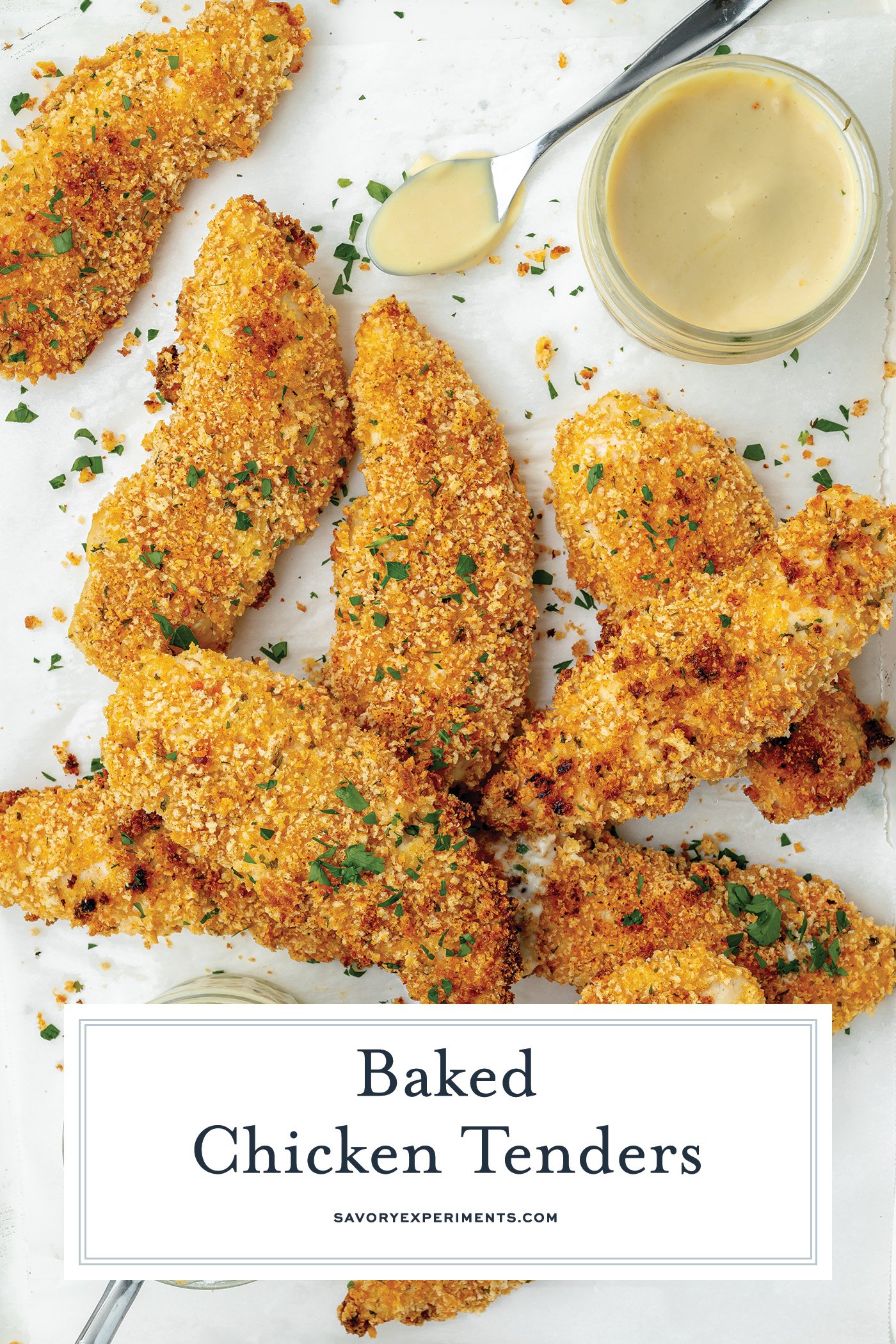 overhead shot of crispy baked chicken tenders with text overlay for pinterest