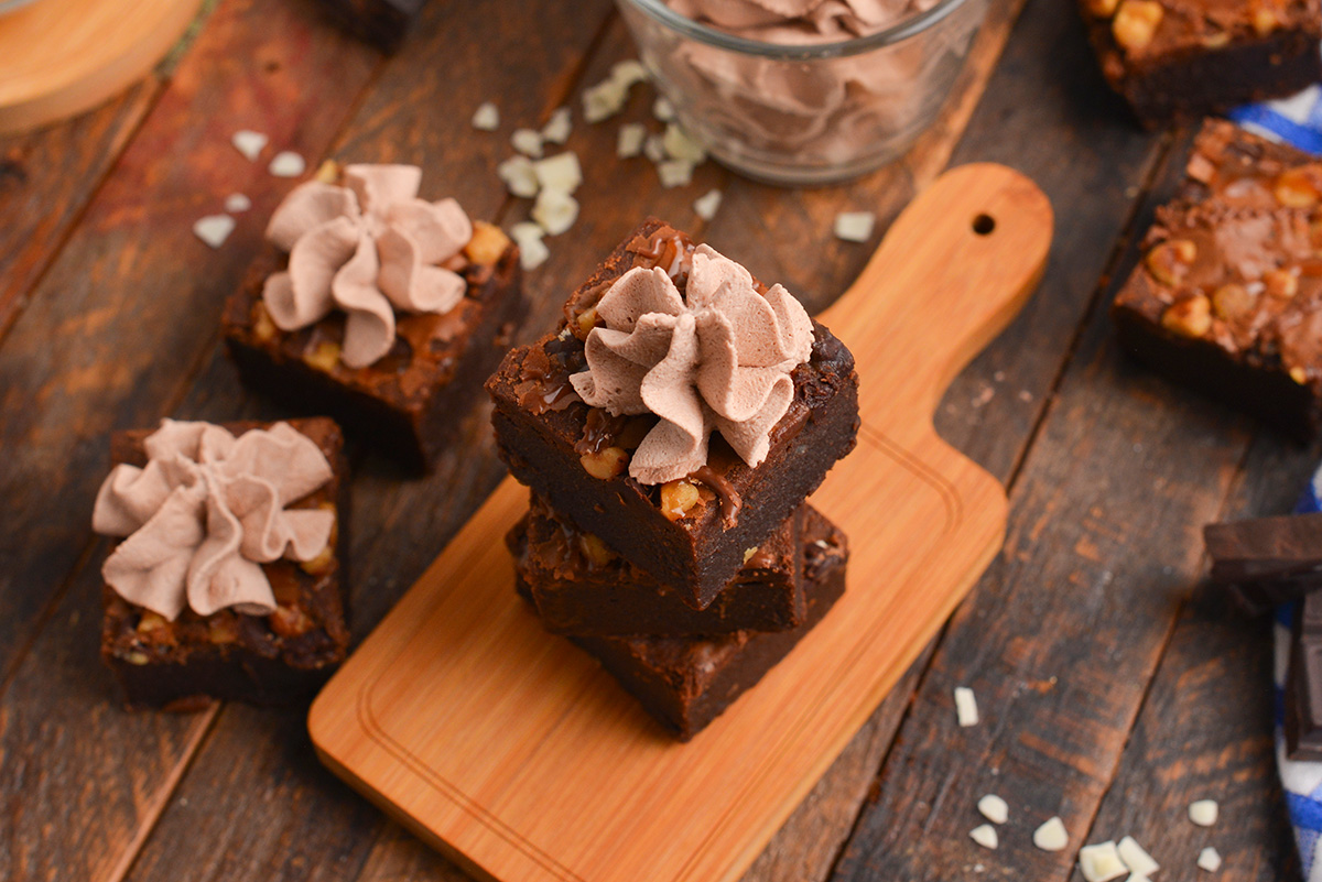 angle stack of brownies with whipped cream flower on top