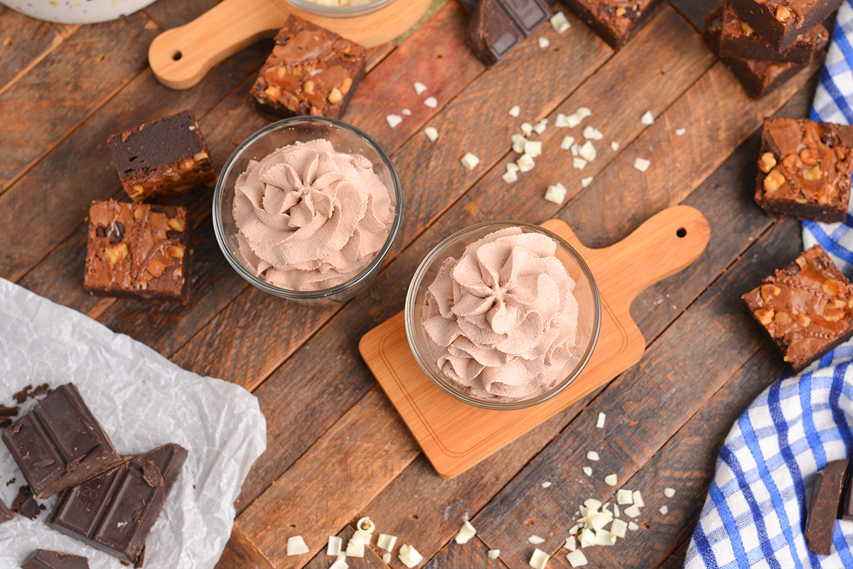 overhead chocolate whipped cream surrounded by turtle brownies