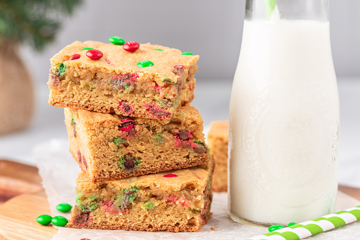 straight on shot of stack of blondies with milk