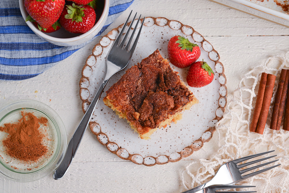 overhead shot of cinnamon sugar biscuit on plate with fork