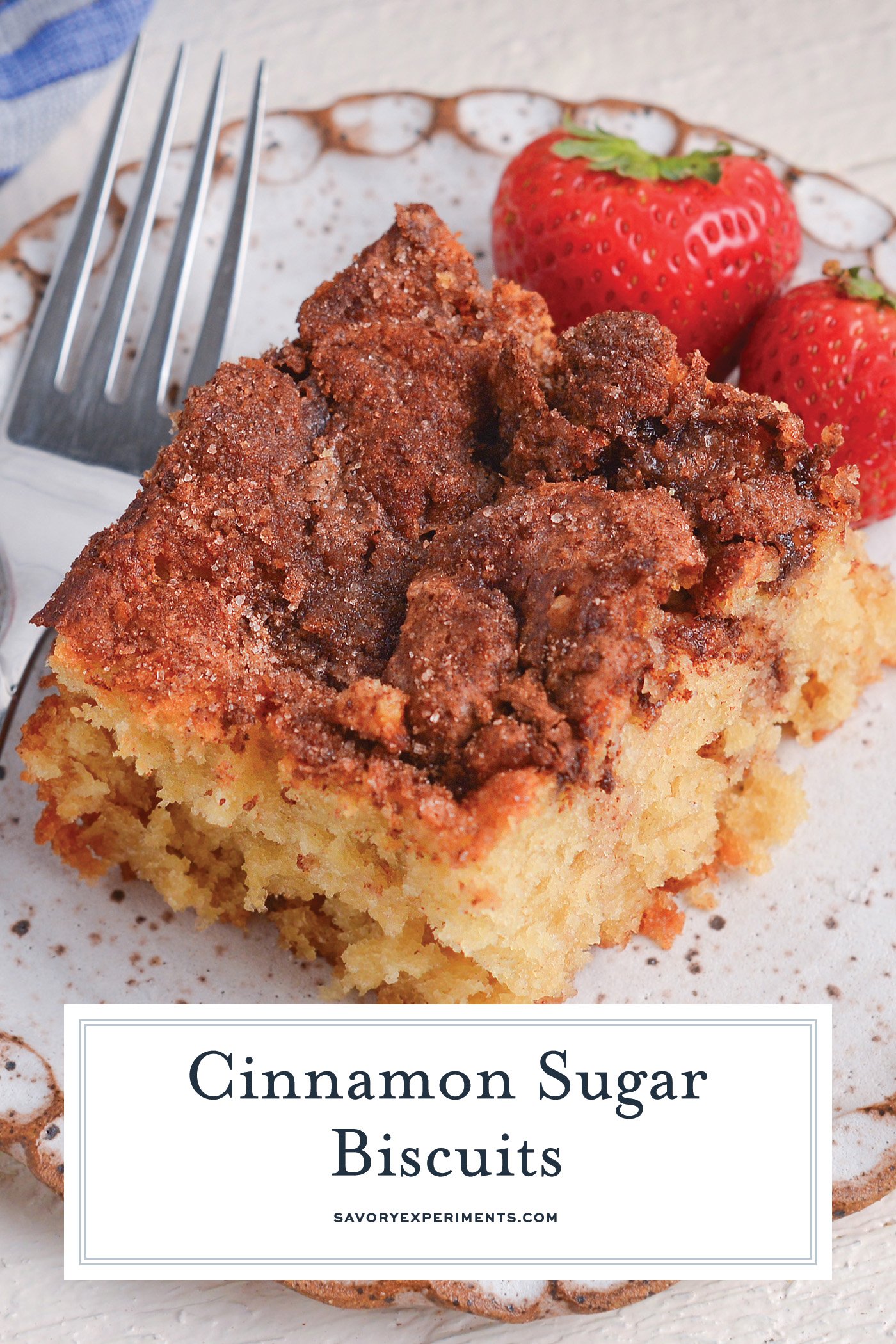 close up angled shot of cinnamon sugar biscuit on plate with text overlay for pinterest