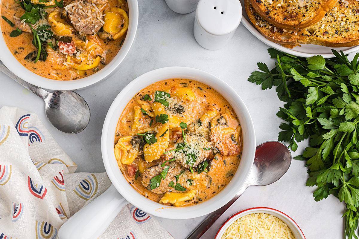 overhead shot of bowls of tortellini soup