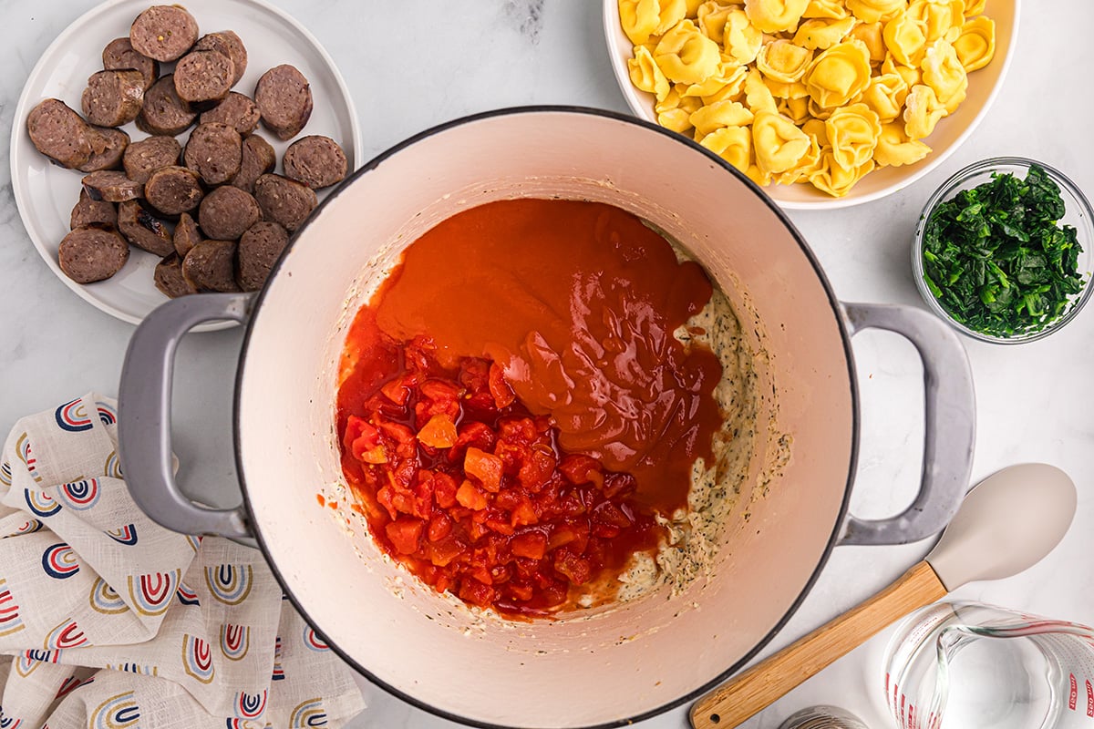 tomatoes and condensed soup added to pot