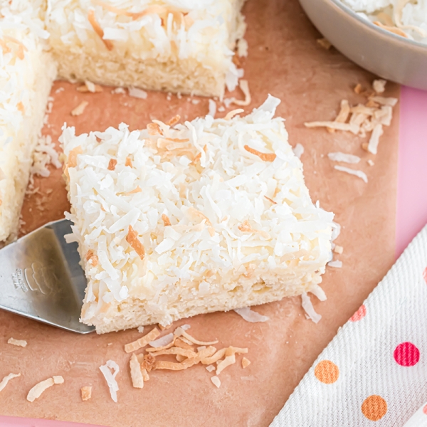 spatula holding one square of coconut bars