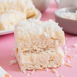 stack of frosted coconut cookie bars