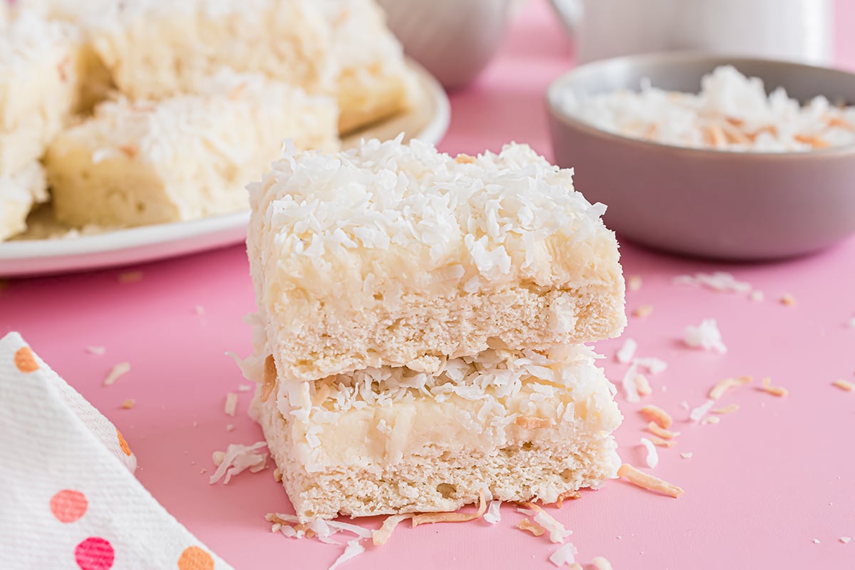stack of frosted coconut cookie bars