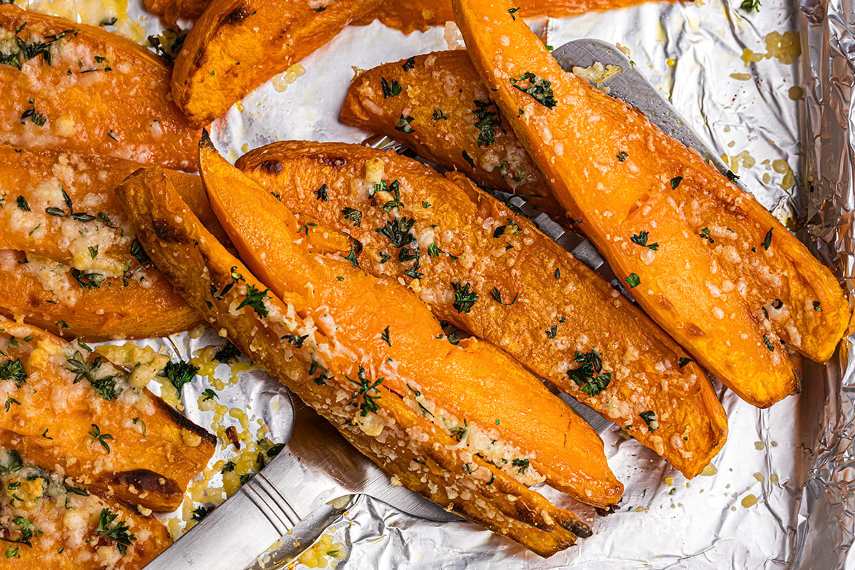 close up overhead shot of baked sweet potato fries on spatula