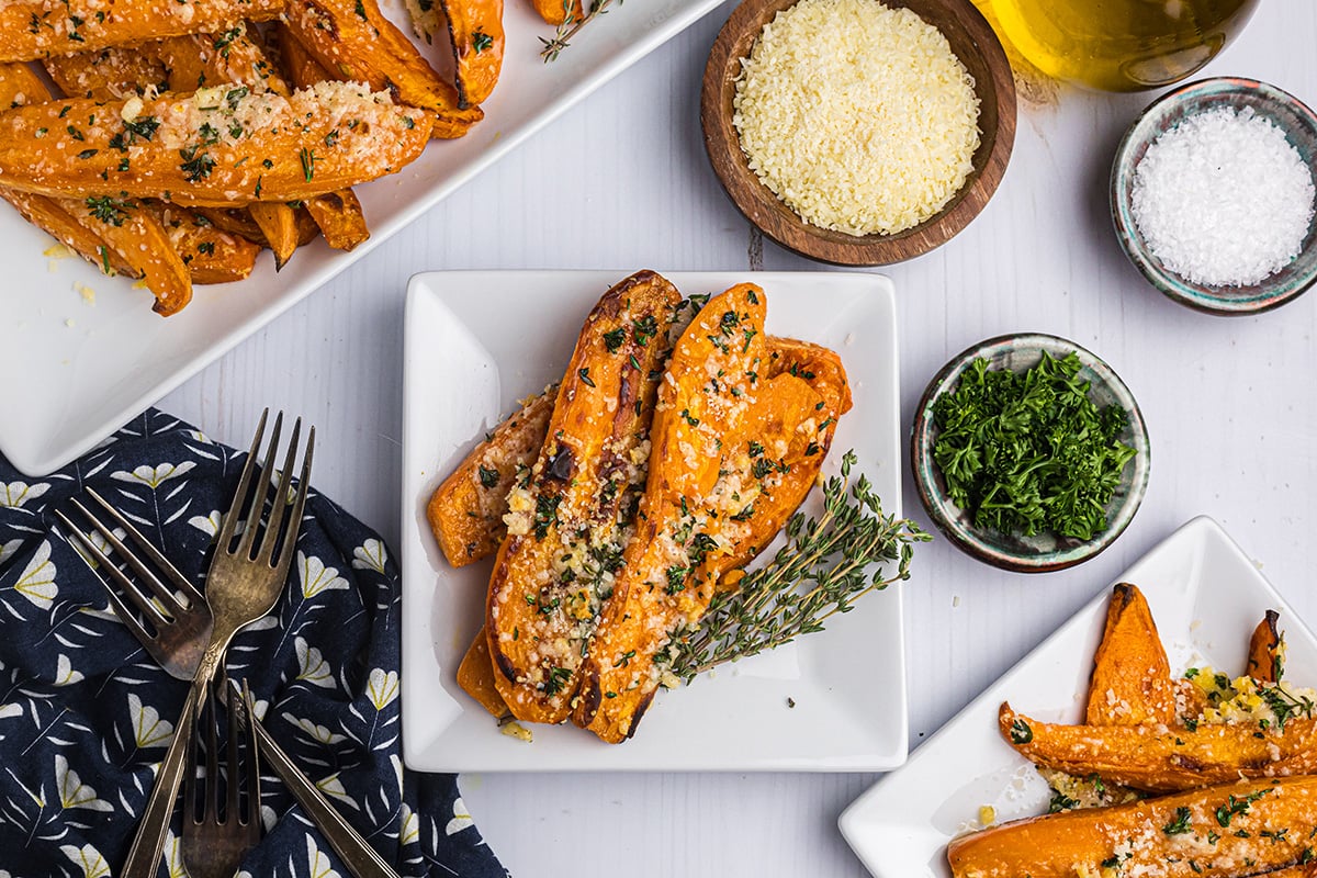 overhead shot of garlic parmesan baked sweet potato fries on a plate