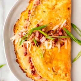 overhead shot of ham and cheese omelet on plate