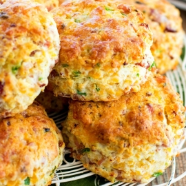 angled shot of basket of ham and cheese biscuits