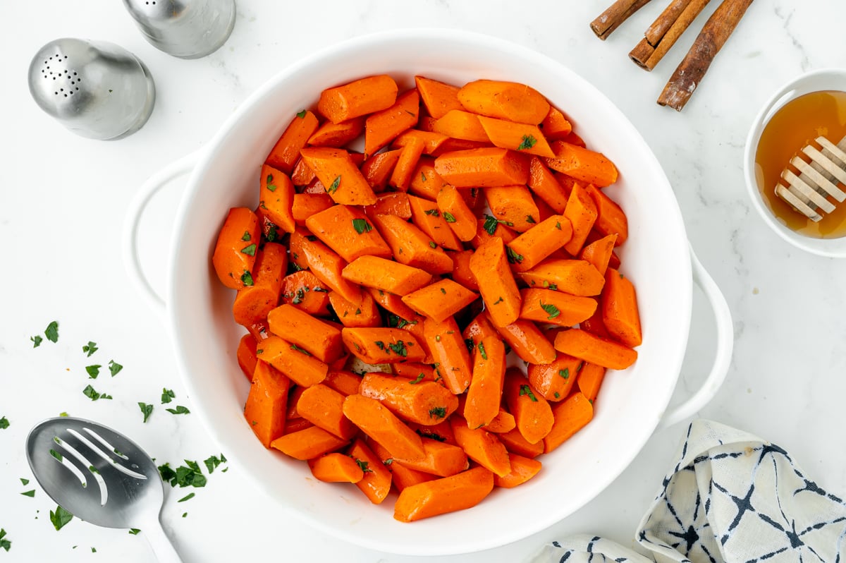 overhead shot of honey glazed carrots in serving bowl