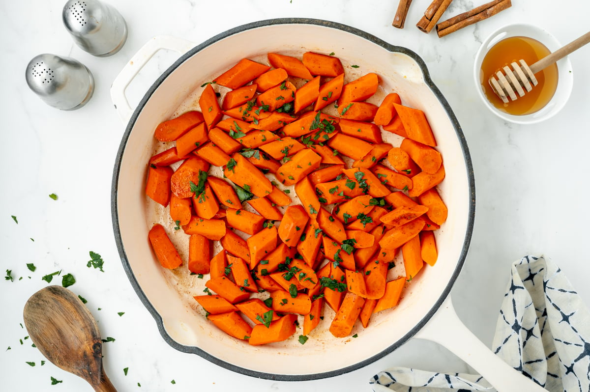overhead shot of carrots in pan with parsley