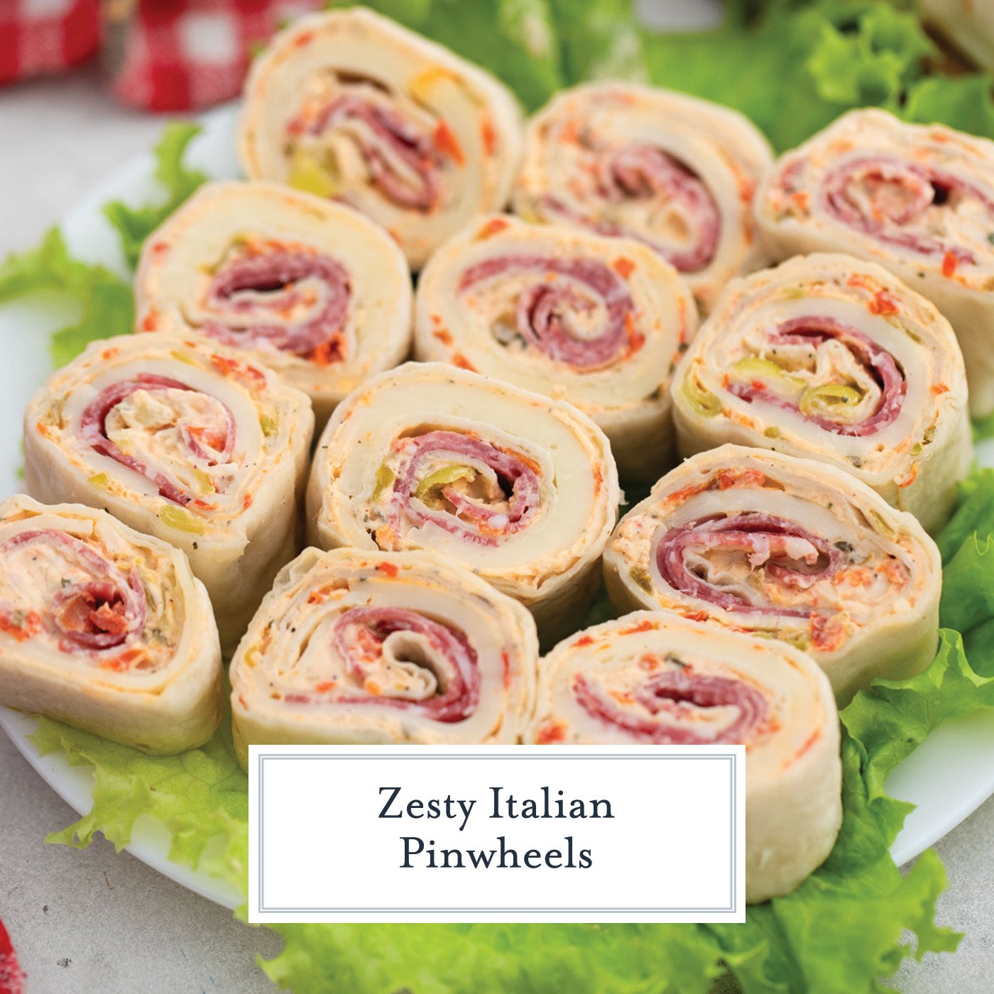 angled shot of platter of italian pinwheels with text overlay for facebook