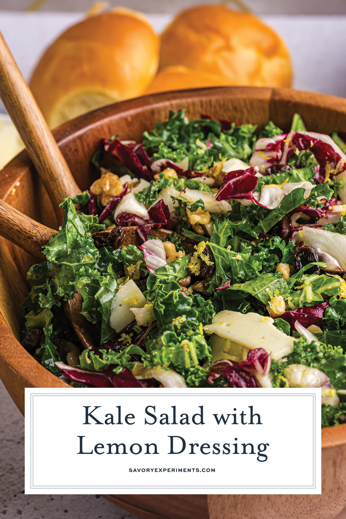 angled shot of bowl of kale salad with text overlay for pinterest