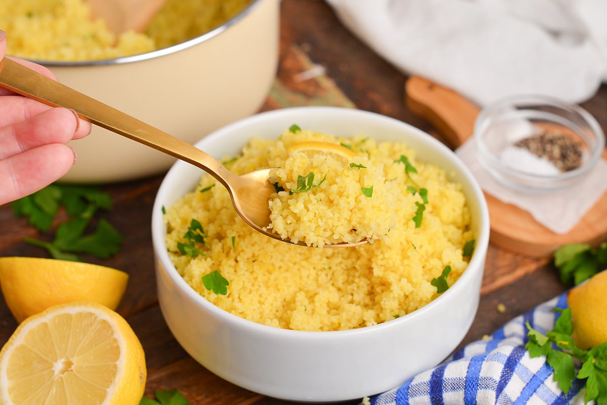 angled shot of spoon full of lemon couscous