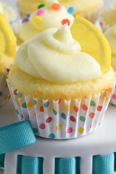 close up of a lemon cupcake in a confetti cupcake liner