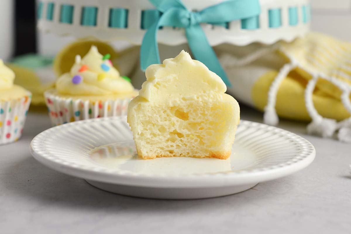 frosted lemon cupcake cut in half