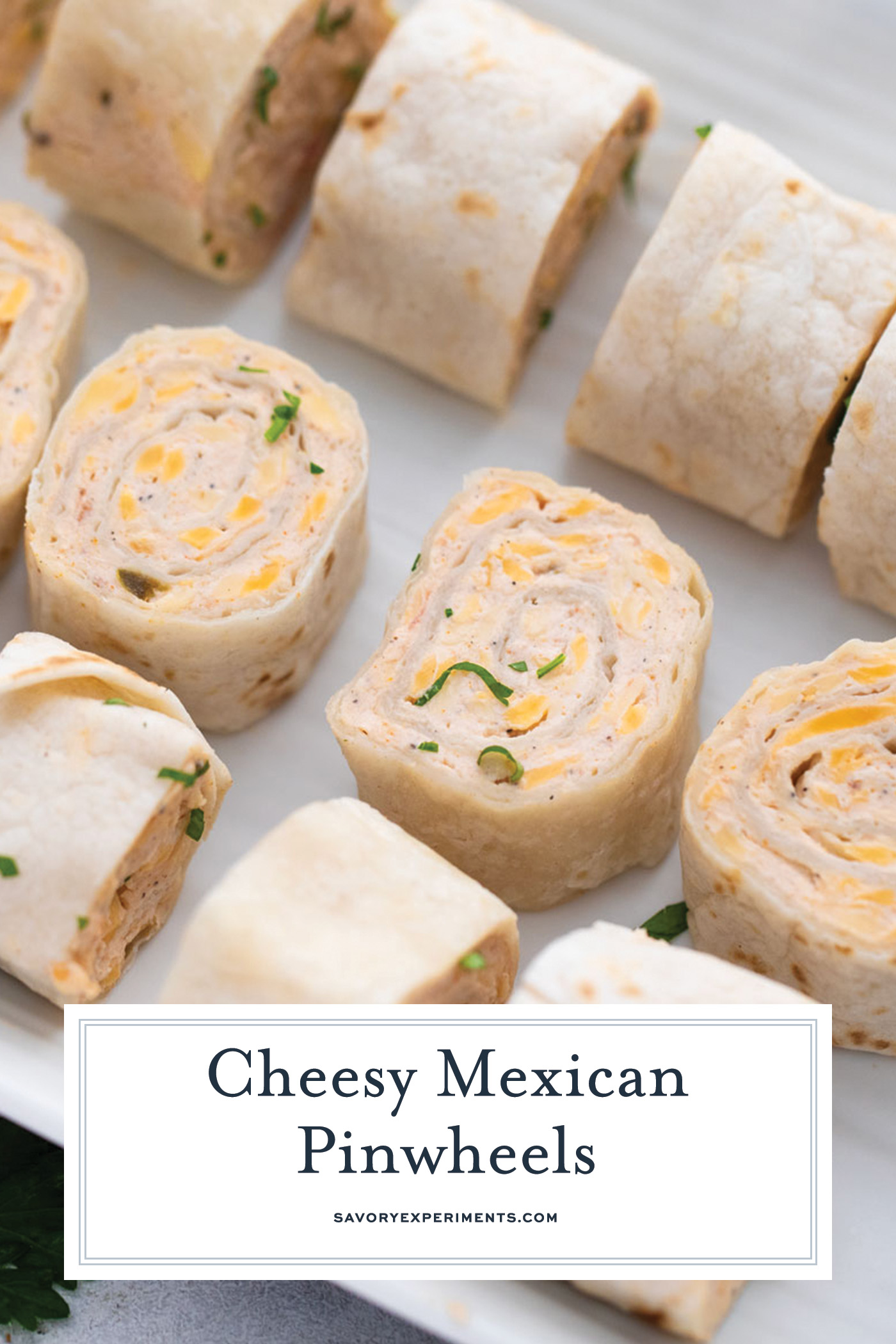 angled shot of mexican pinwheels on tray with text overlay for pinterest