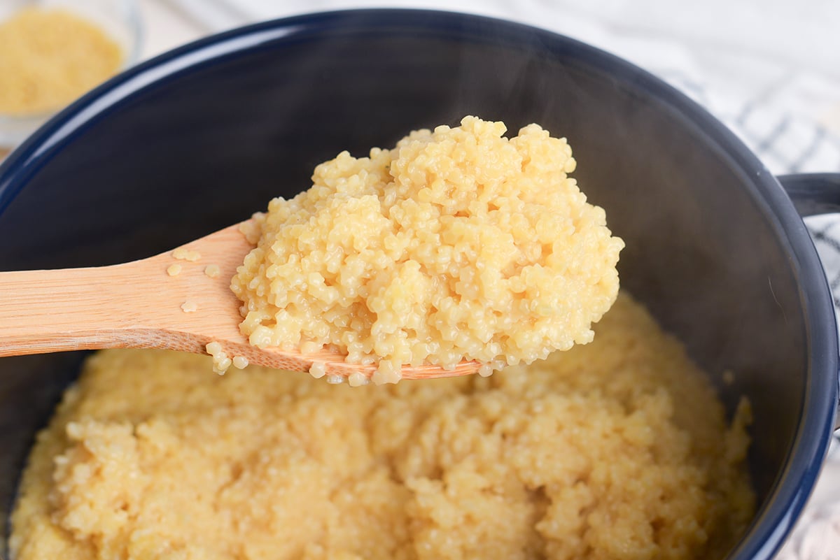 wooden spoon holding pastina