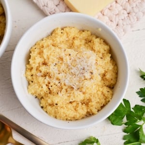 close up bowl of creamy italian pastina with cheese