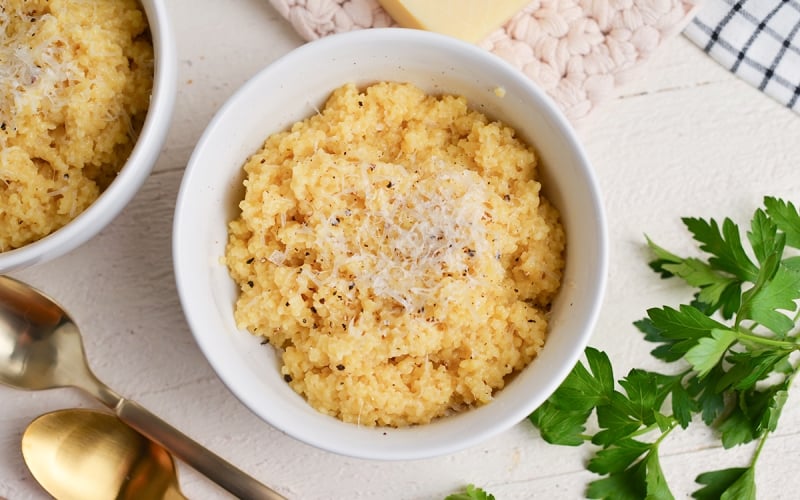 close up bowl of creamy italian pastina with cheese