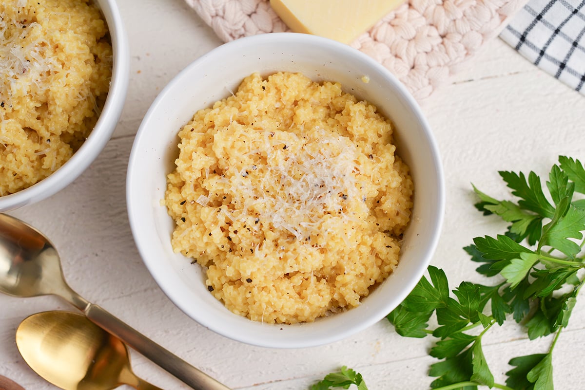 close up bowl of creamy italian pastina with cheese