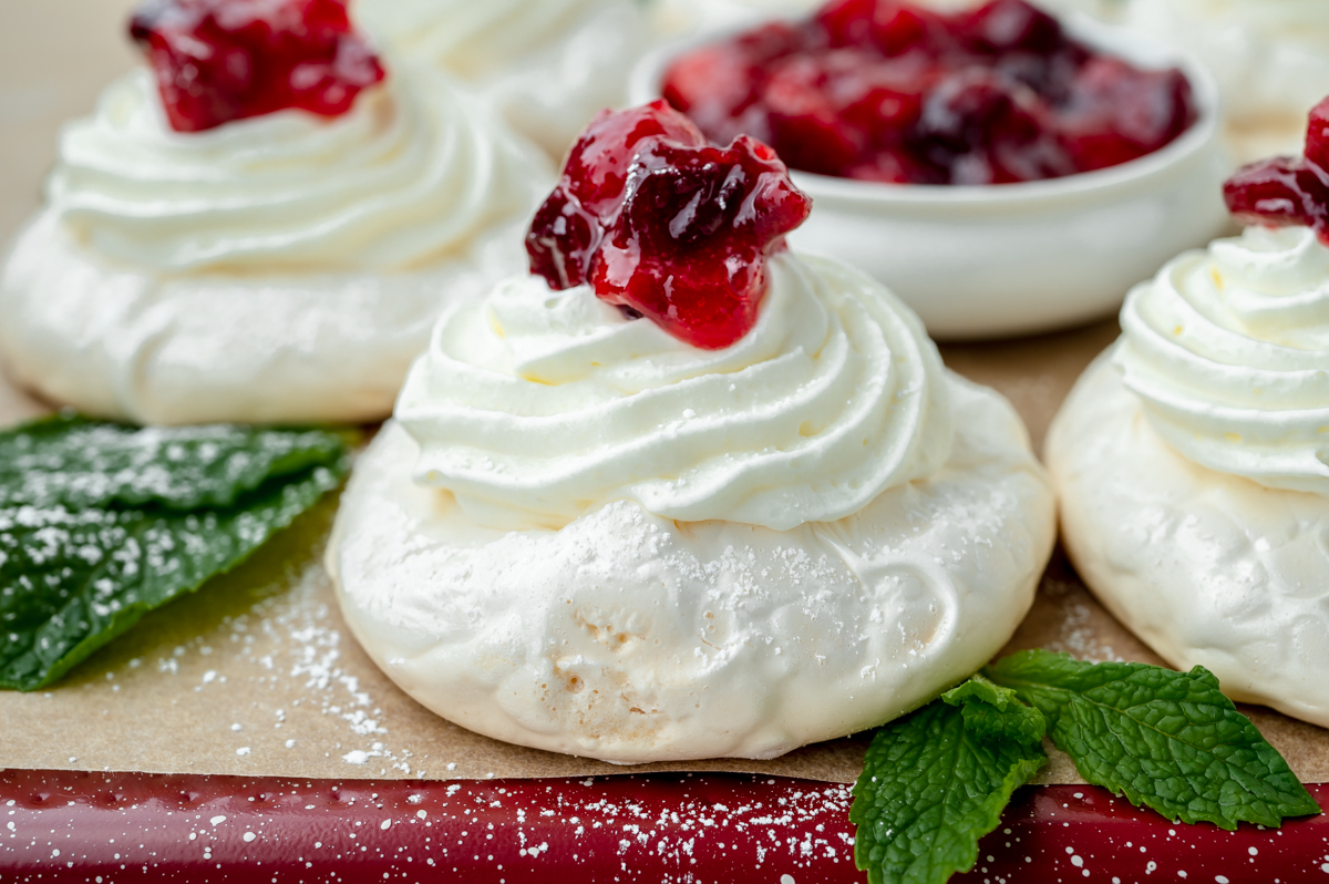 straight on shot of pavlova wreath on baking sheet