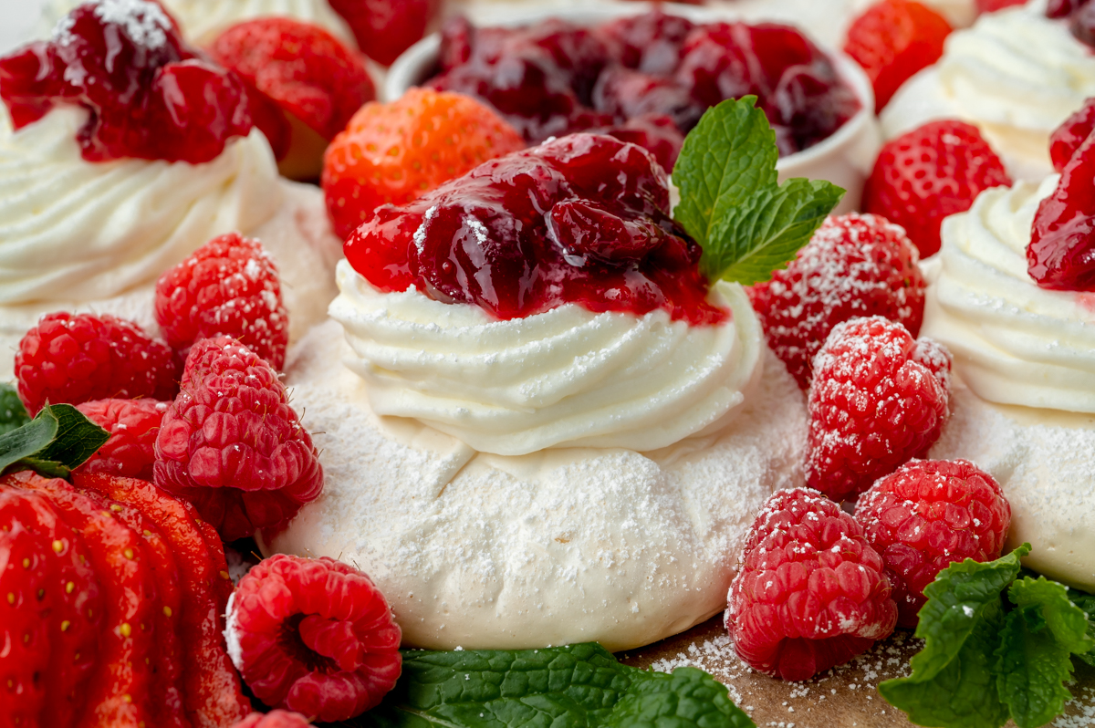close up angled shot of meringue with berries