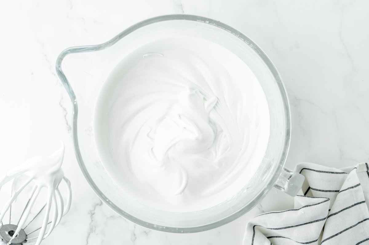 overhead shot of whipped egg whites in bowl