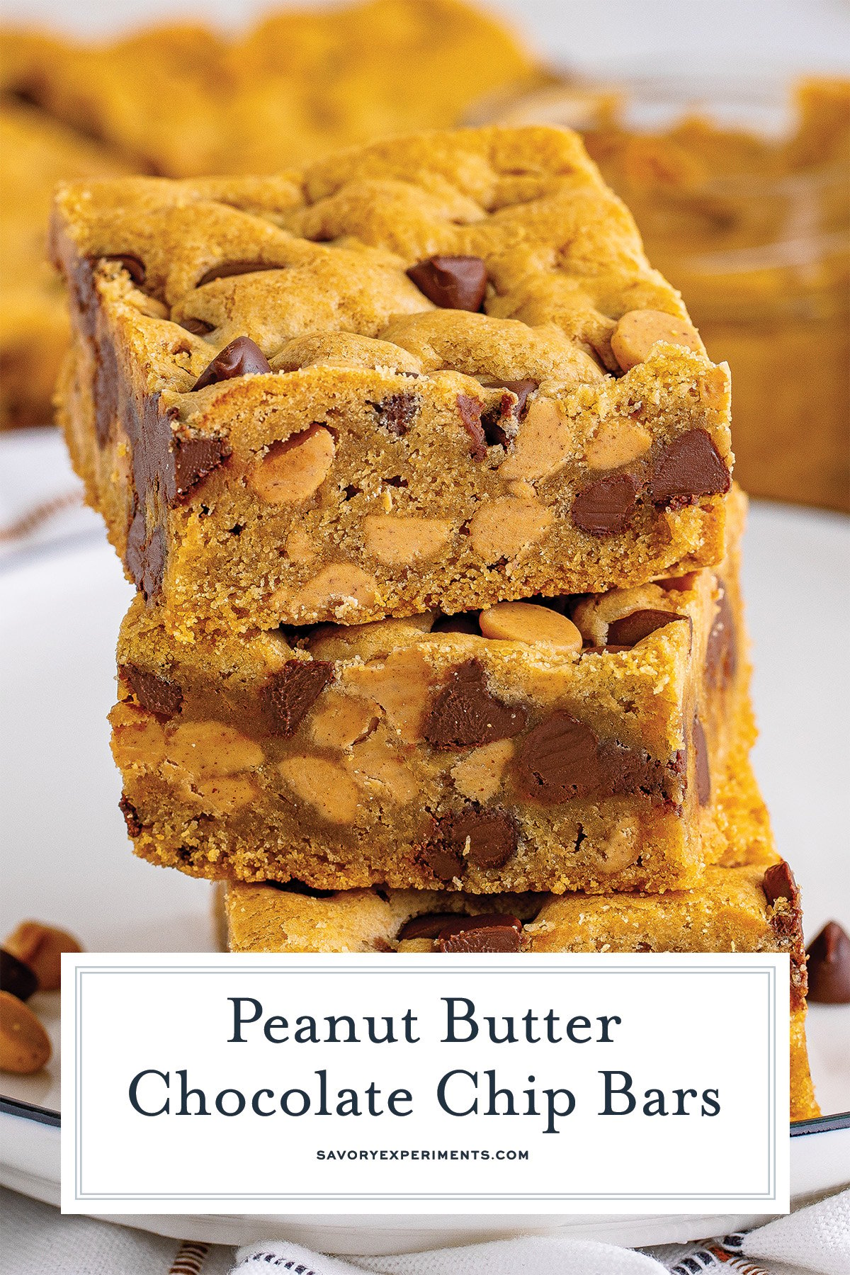 close up stack of peanut butter cookie bars with chocolate chips